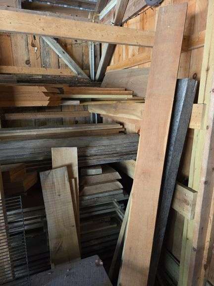 Assortment of stacked lumber. Under roof, lots of 8ft & 10ft variety of species Buyer responsible fo