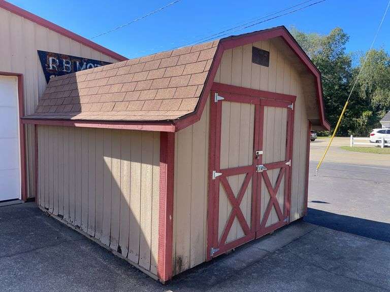 10x12 tan and red storage barn - contents not included