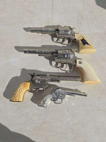 LOT OF 4 CAP GUNS INCLUDING HUBLEY, GABRIEL