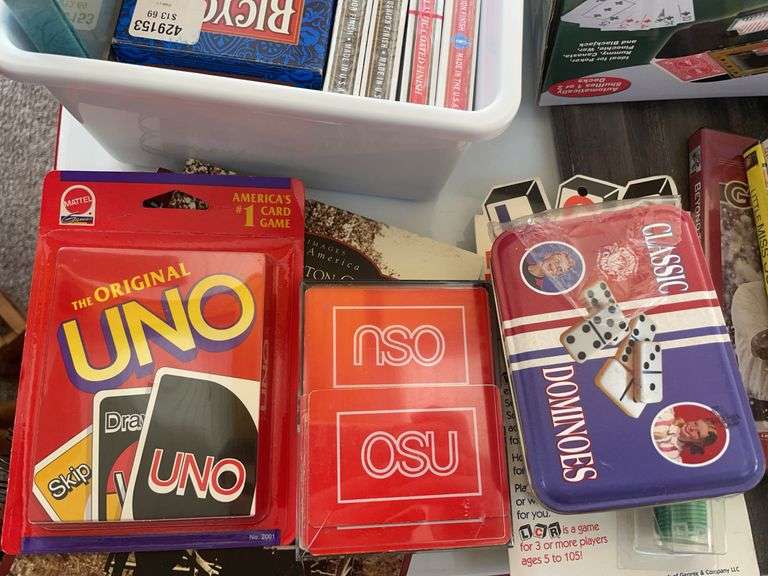 Lot of games & movies including card shuffler, playing cards, LCR & others