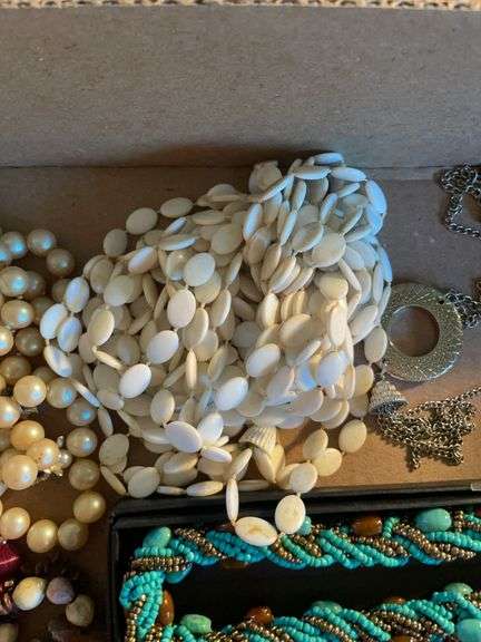 Flat of costume jewelry - mostly necklaces