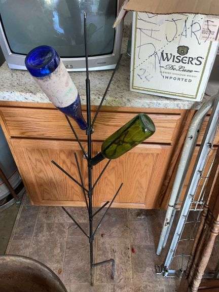 Box of empty wine bottles & decorative rack