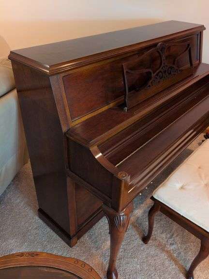 Young piano with bench seat