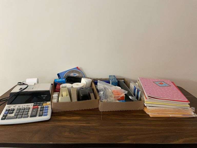 Adding machine and (2) flats of office supplies