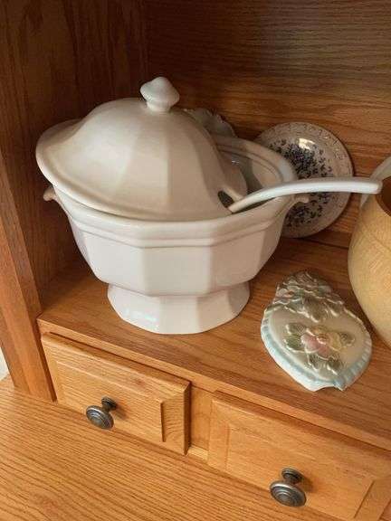 Shelf of glassware - plates, bowls, and more