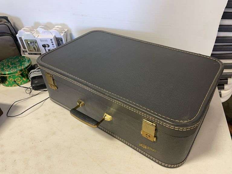 Suitcase, camera with bag, antique General Electric speaker, tin, and more