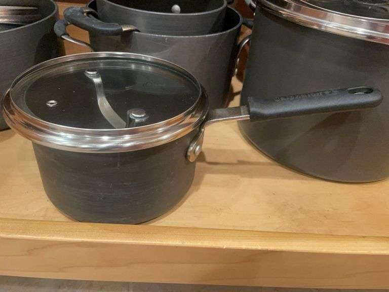 Kitchen drawer w/ mostly pots & lids