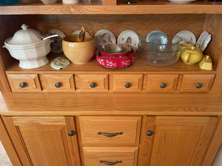 Shelf of glassware - plates, bowls, and more