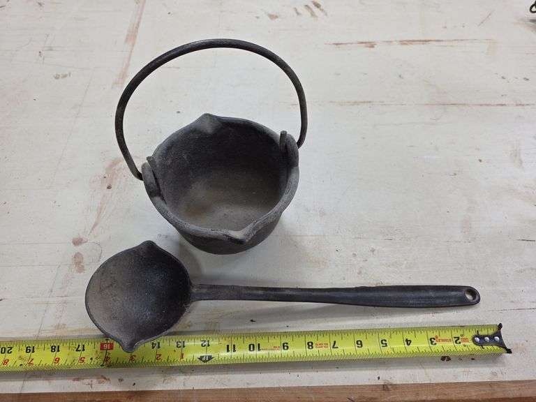 Small cast iron pot w/ ladle