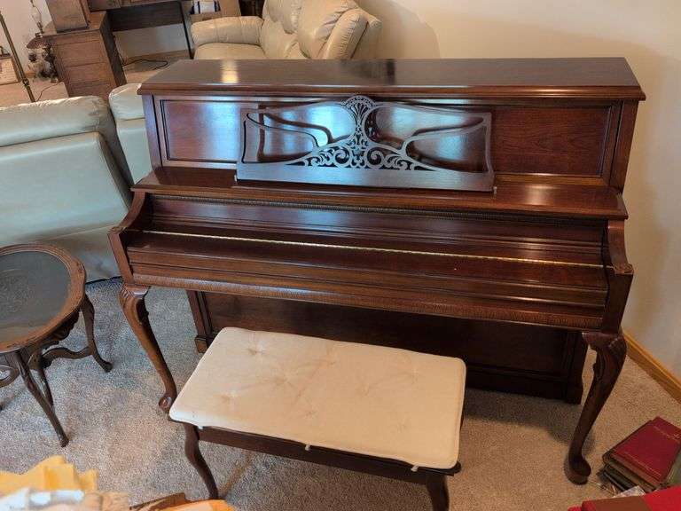 Young piano with bench seat