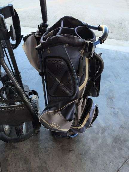 Wilson Staff golf bag and Sun Mountain bag carrier