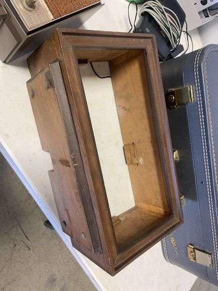 Suitcase, camera with bag, antique General Electric speaker, tin, and more