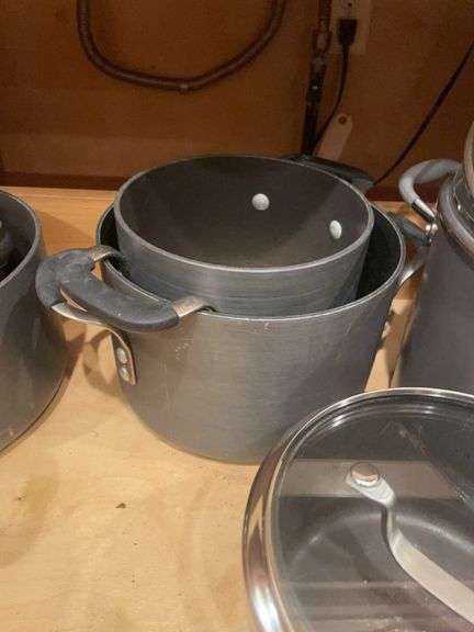 Kitchen drawer w/ mostly pots & lids