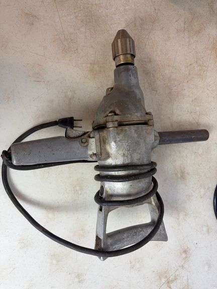 Small propane heater, carpenter's squares, and drill