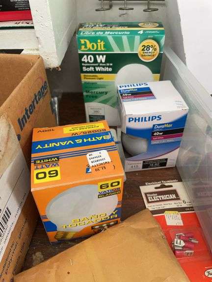 Contents of shelving including lightbulbs, screw-in hooks & more