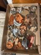 (2) flats of antique cookie cutters and icing dispensers