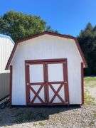 10x14 White and red storage barn - contents not included