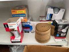 Contents of shelving including lightbulbs, screw-in hooks & more