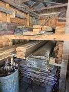 Assortment of stacked lumber. Under roof, lots of 8ft & 10ft variety of species Buyer responsible fo