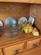 Shelf of glassware - plates, bowls, and more