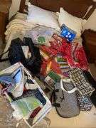 Large assortment of purses, tablecloths, and storage bags