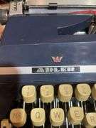 Antique Adler typewriter with case