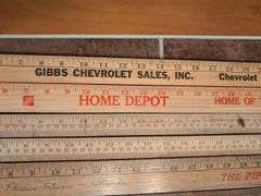 Advertisement yard sticks and (2) Dresden clocks