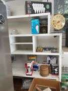 Contents of shelving including lightbulbs, screw-in hooks & more