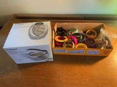 Flat of costume jewelry - mostly bracelets and earrings, and jewelry cleaner