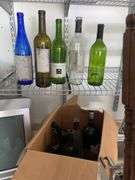 Box of empty wine bottles & decorative rack