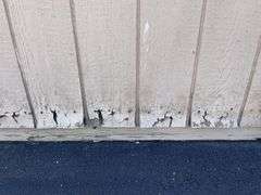 10x12 tan and red storage barn - contents not included