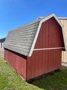 Red and white 8x12 storage barn - contents not included