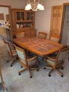 Matching dining table and (6) swivel chairs
