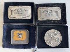 (4) John Deere belt buckles