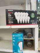 Contents of shelving including lightbulbs, screw-in hooks & more