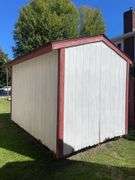 8x12 White and red storage barn - contents not included