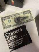 Suitcase, camera with bag, antique General Electric speaker, tin, and more