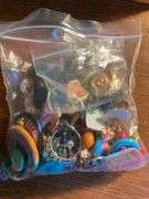 Flat of costume jewelry - mostly bracelets and earrings, and jewelry cleaner