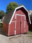Red and white 8x12 storage barn - contents not included