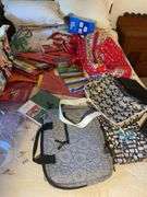 Large assortment of purses, tablecloths, and storage bags