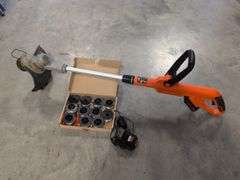 Black and Decker electric trimmer with charger and extra line/caps