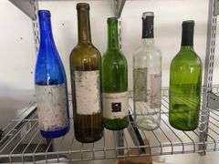 Box of empty wine bottles & decorative rack