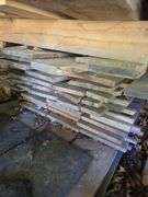Assortment of stacked lumber. Under roof, lots of 8ft & 10ft variety of species Buyer responsible fo