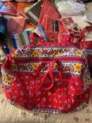 Large assortment of purses, tablecloths, and storage bags