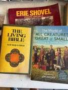 Large assortment of Clive Cussler books and other books