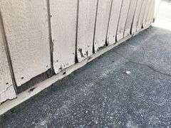 10x12 tan and red storage barn - contents not included