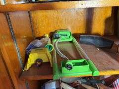 (3) shelves of gardening items including planters, sprinklers, small hose & more