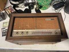 Suitcase, camera with bag, antique General Electric speaker, tin, and more