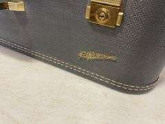 Suitcase, camera with bag, antique General Electric speaker, tin, and more