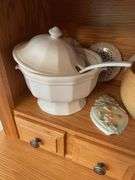 Shelf of glassware - plates, bowls, and more